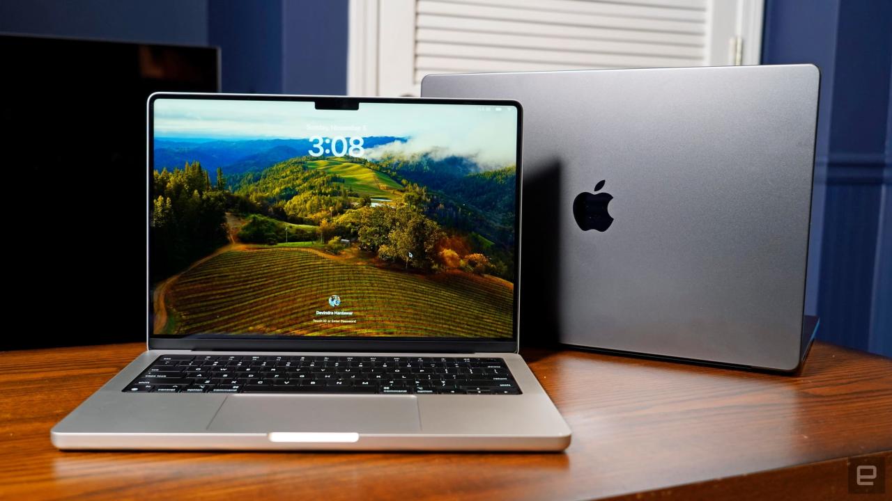 An Apple laptop and MacBook Pro on a desk, showcasing the benefits of choosing refurbished laptops for quality and savings.